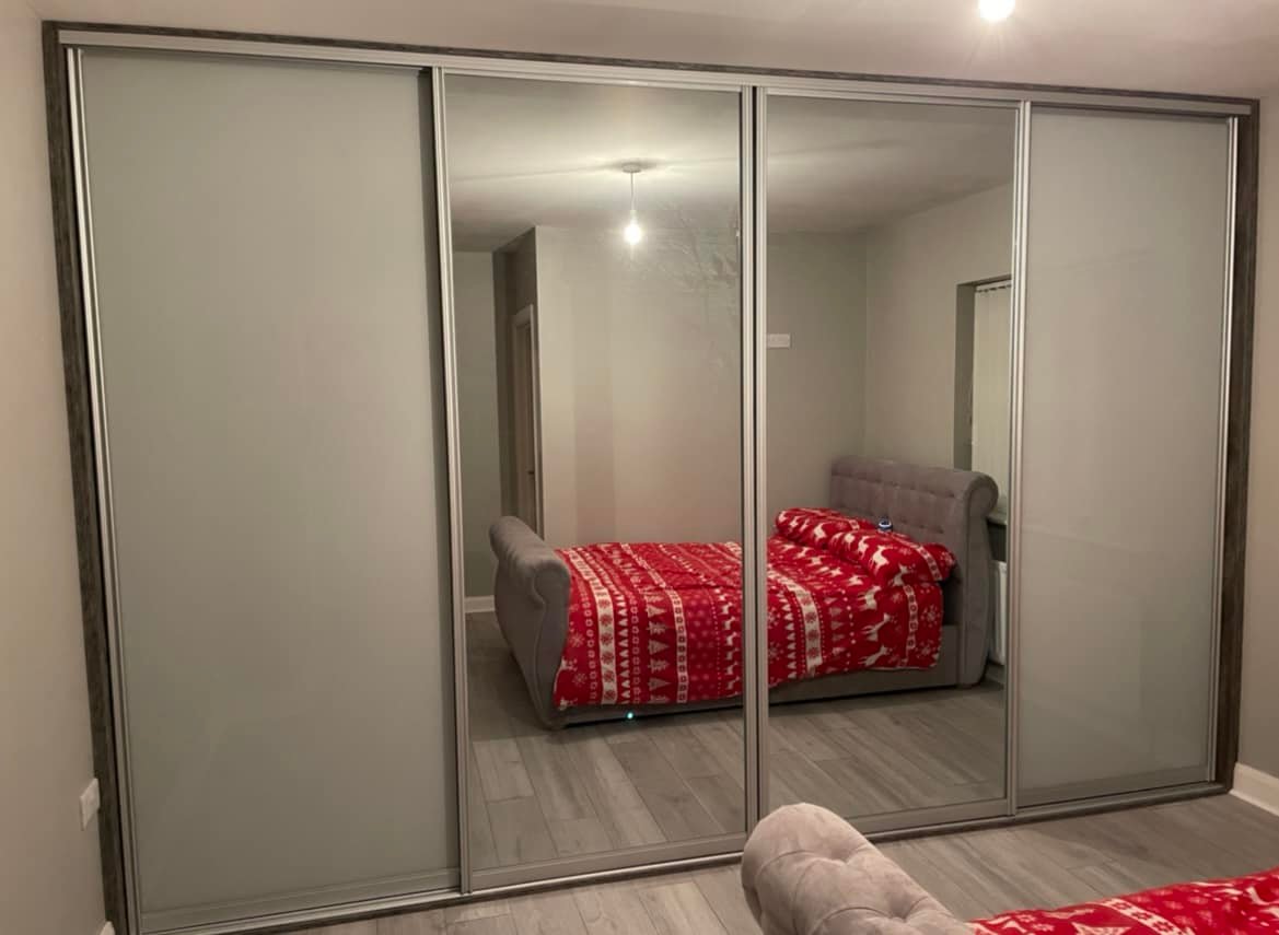 grey bedroom with double mirrored sliderobe