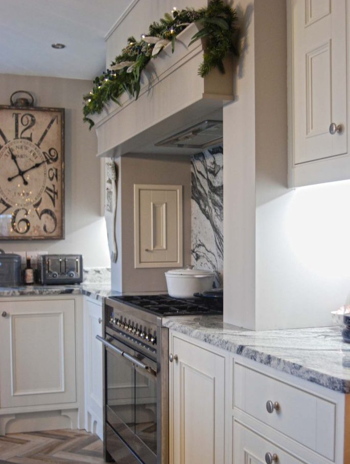 White and grey country style kitchen with clock art